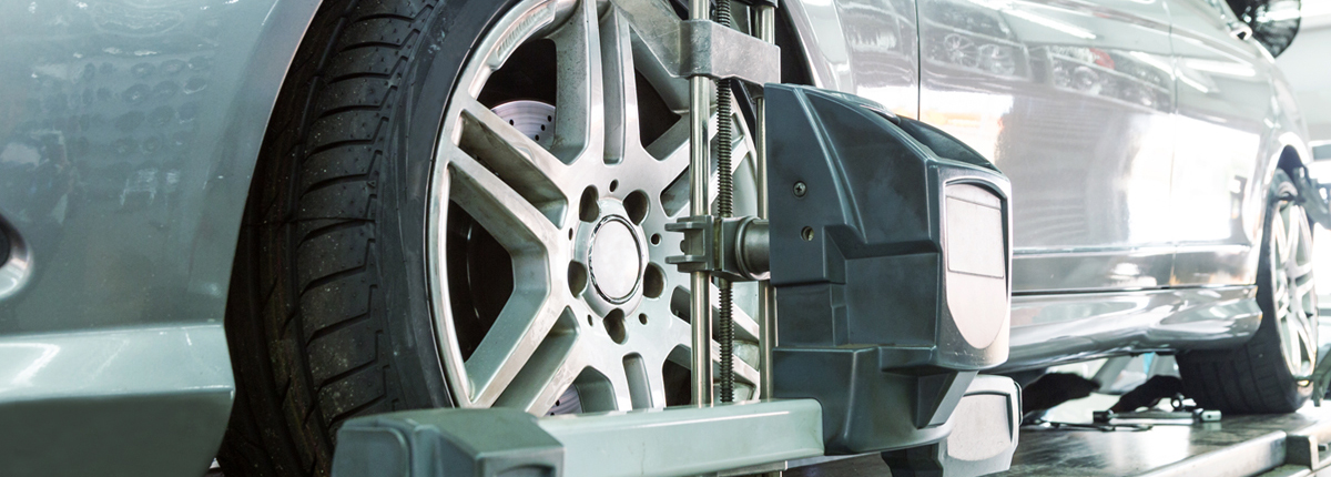 A vehicle on a ramp having its wheels aligned - Wheel Alignment Soham, Ely